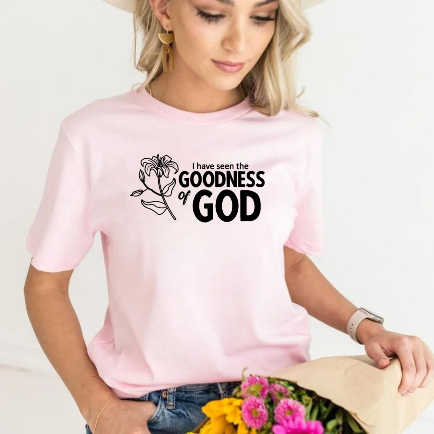 T-shirt "La Bondad de Dios" rosa claro. En inglés y español